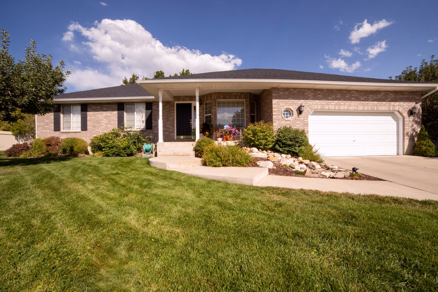 Residential home and property with landscaped exterior